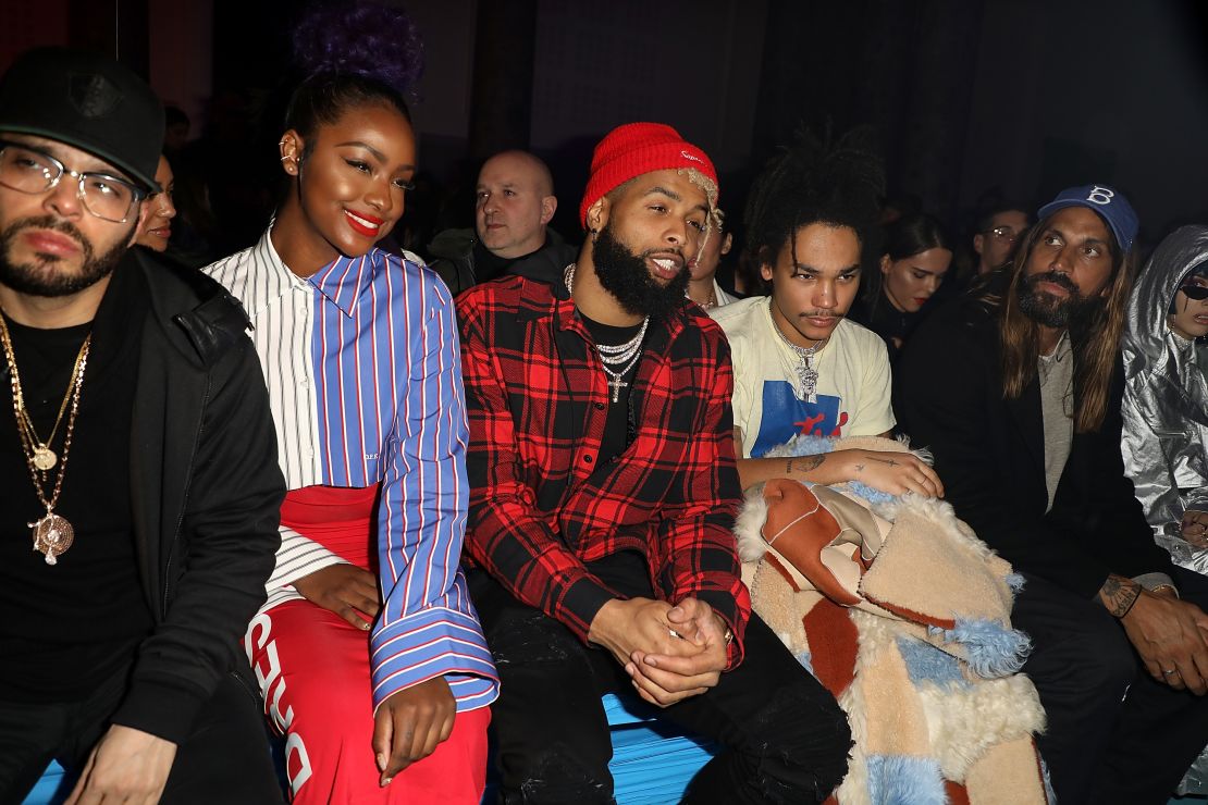 Beckham sits front from at the Off-White Autumn-Winter 2018 show in March 2017.