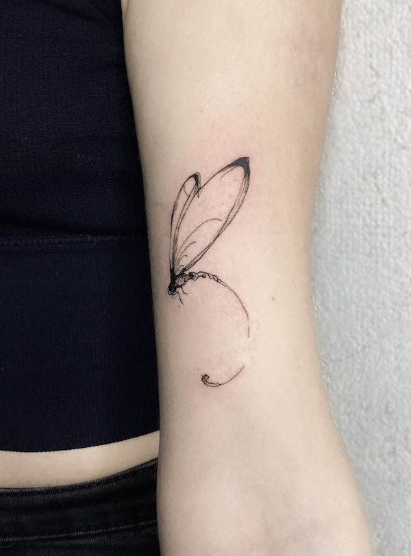 Abstract dragonfly tattoo by @koon.tattoo