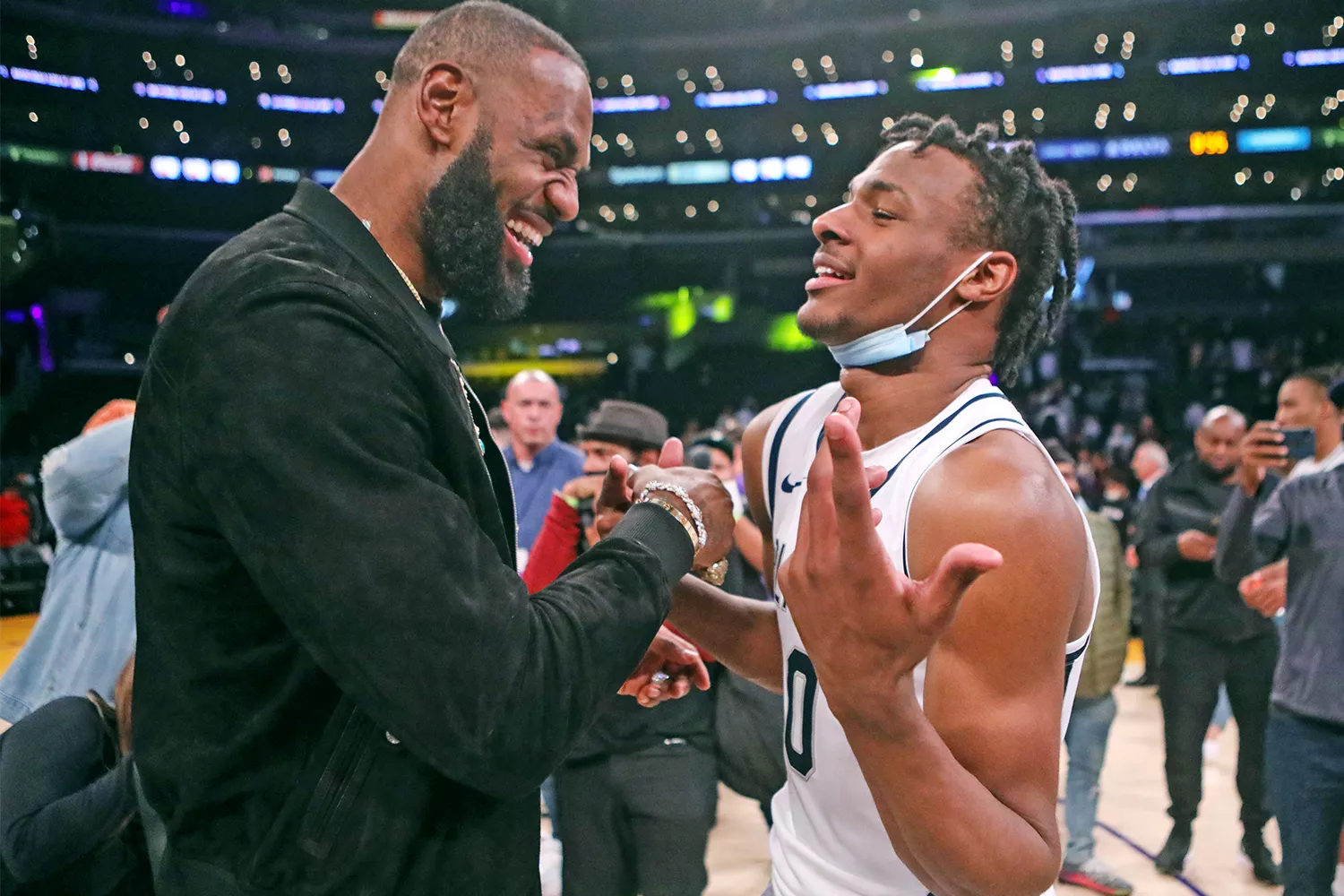 LOS ANGELES, CA - DECEMBER 04: Lebron James comes onto the court to congratulate his son Bronny James (0) point guard for Sierra Canyon after his team won against St. Vincent-St. Mary during The Chosen - 1's Invitational High School Basketball Showcase at the Staples Center on Saturday, Dec. 4, 2021 in Los Angeles, CA. (Jason Armond / Los Angeles Times via Getty Images)