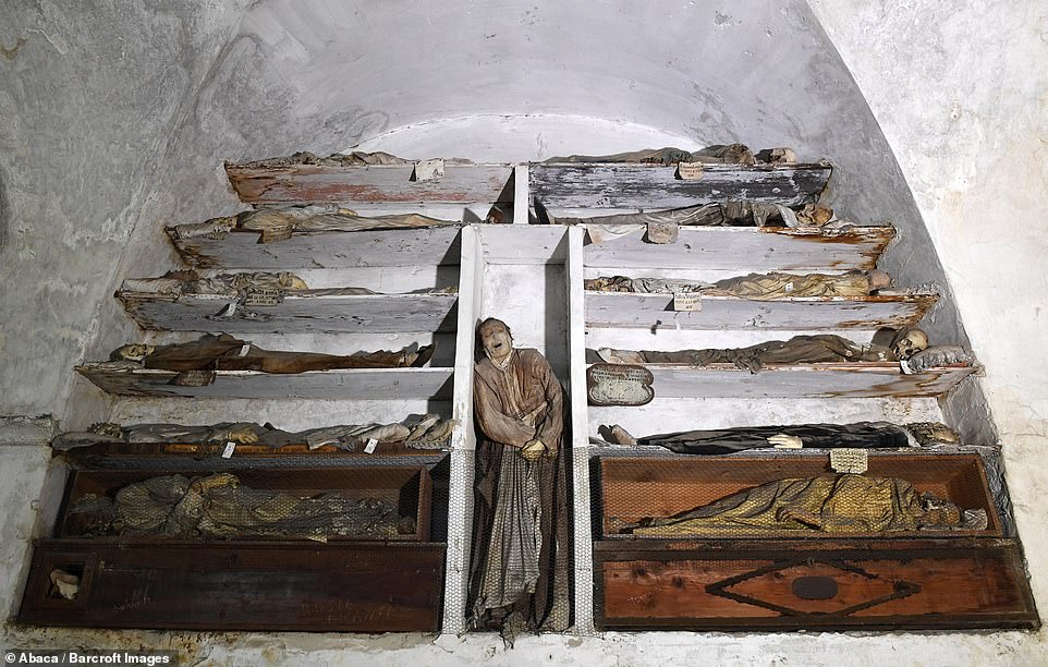 The last burials are from the 1920s. The picture above shows mummified corpses stacked up on shelves with one being central to the alcove of the wall