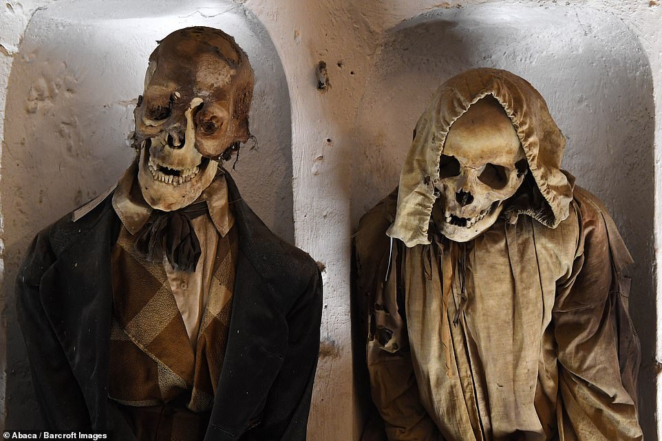 Palermo's Capuchin monastery outgrew its original cemetery in the 16th century and monks began to excavate crypts below it. Picture above shows what looks to be a woman and a man, the man wearing a necktie and the woman wearing a bonnet