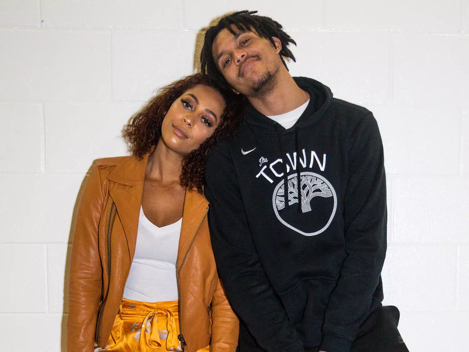 Sydel Curry Lee (L) and Damion Lee (R) pose after the Golden State Warriors vs Miami Heat game on February 27, 2019