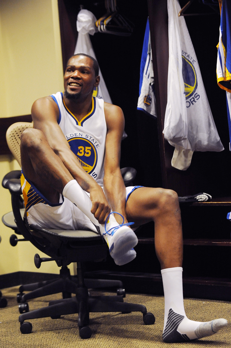 OAKLAND, CA - JULY 7: Kevin Durant #35 of the Golden State Warriors prepares in the locker room before his introductory press conference on July 7, 2016 in Oakland, California.